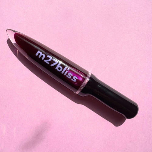 Spooky Malbec lip gloss — deep purple high-shine gloss with a wine-inspired tint and glassy finish by m27bliss