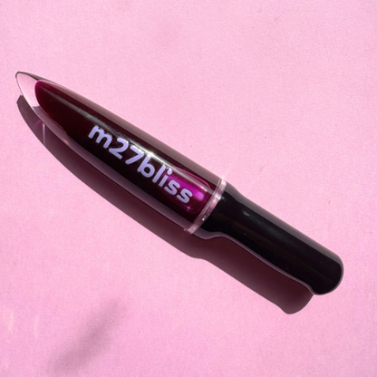 Spooky Malbec lip gloss — deep purple high-shine gloss with a wine-inspired tint and glassy finish by m27bliss